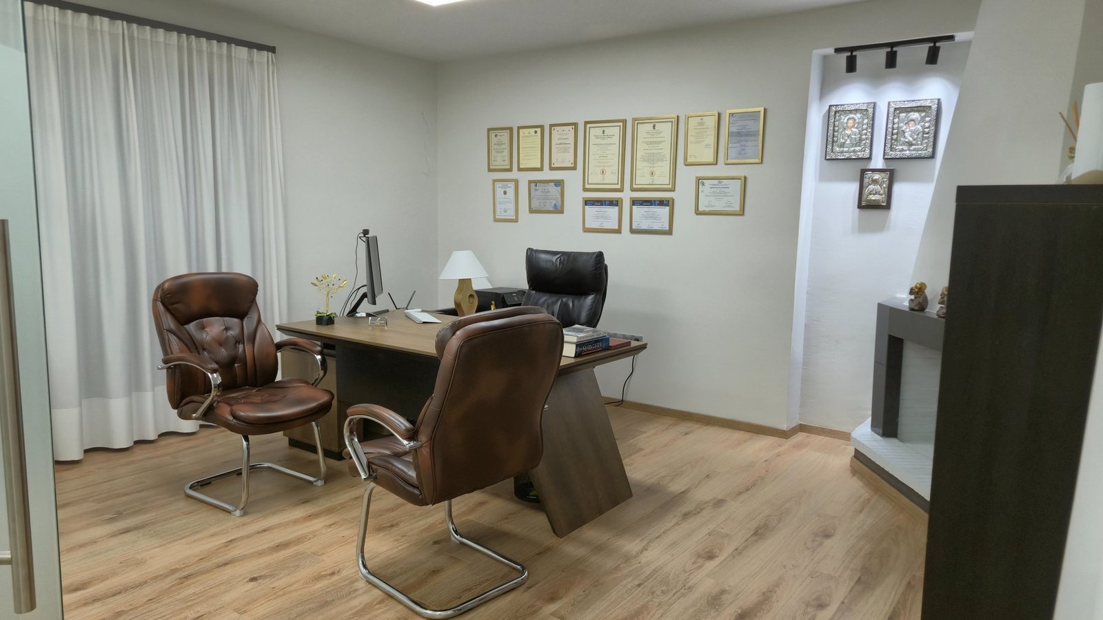 Office wall with diplomas and certifications